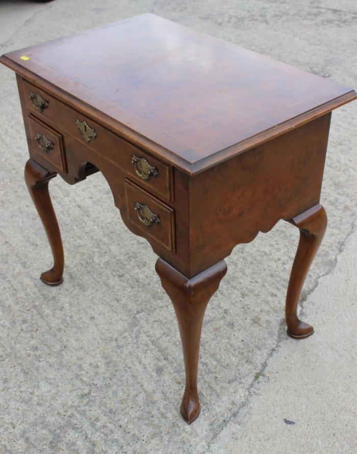 A well reproduced walnut lowboy with quarter veneered top, fitted one long and two small drawers, on - Image 5 of 7