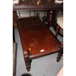 A 19th century mahogany low table, on turned supports, 38" wide x 18" deep x 11" high