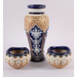 A 19th century Doulton Lambeth baluster vase, 11" high, and a pair of Royal Doulton relief decorated