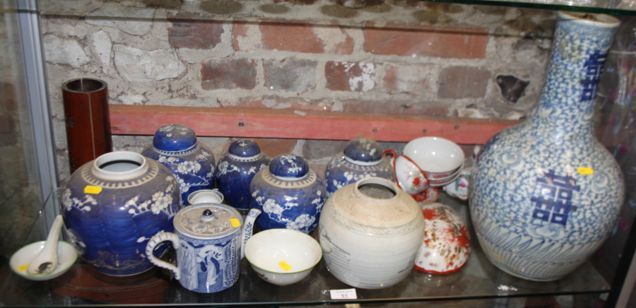 A Chinese blue and white bottle vase, 16" high (heavily restored), a collection of ginger jars,