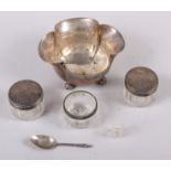 A silver bowl of lobed form, two glass dressing table jars with silver tops, a Continental silver