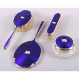 A 1960s silver and blue enamel four-piece dressing table set, decorated naval coronets