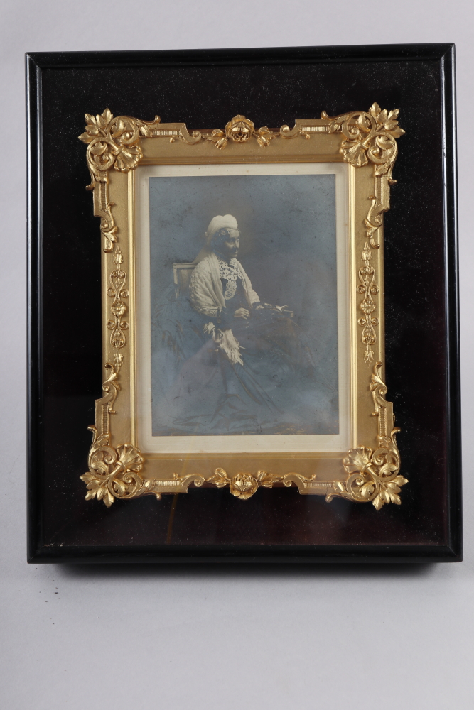 A late 19th century black and white photograph portrait of an old woman, 11" x 9.5", in ebonised and