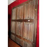 A section of 16th century oak linen-fold panelling, now converted as a bed head, 44" x 78"