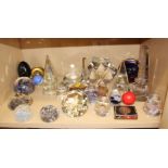 Eleven glass paperweights, candle holders and other items