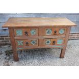 A mid 19th century Gothic carved oak dressing chest, fitted four drawers with wrought handles, on