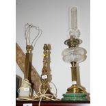An oil lamp with brass column, now converted to electricity, a table lamp, on onyx base, and a