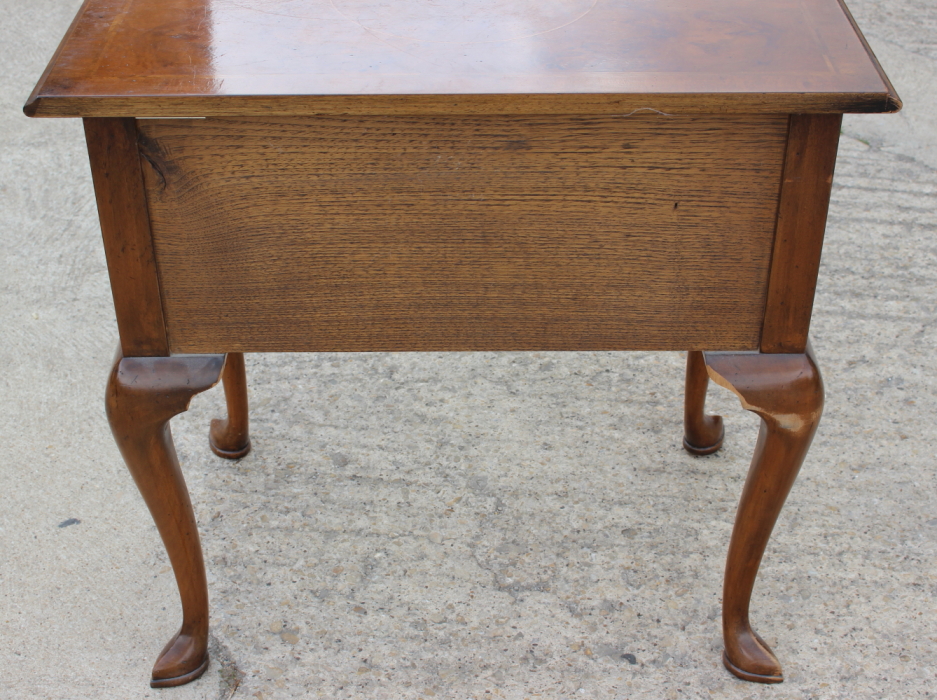 A well reproduced walnut lowboy with quarter veneered top, fitted one long and two small drawers, on - Image 6 of 7