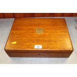 An oak box containing a selection of modern ladies and gentlemen's wristwatches, spares, etc and a