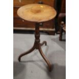 A 19th century mahogany circular top occasional table, on turned column and tripod splay supports