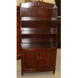 A mahogany bowfront waterfall bookcase over cupboard, 27" wide x 13" deep x 56 1/2" high, and an oak
