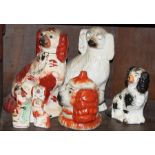 A Staffordshire dog, 10" high, five others, in various sizes, and a similar pot with lid