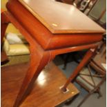 An Edwardian mahogany rectangular topped silver table, on cabriole supports, 25" wide