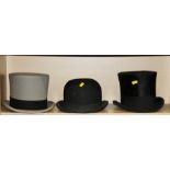 A Lock & Co grey top hat, a black top hat and a Herbert Johnson black bowler hat