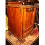 An Edwardian mahogany and banded coal purdonium with raised back, on bracket supports, 15 1/4" wide