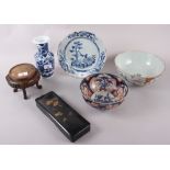 An 18th century Chinese blue and white plate, decorated trees and flowers, an Imari bowl (heavily