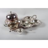 A silver plated muffin dish and cover, a biscuit and cheese dish, and other plate