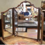 A walnut framed triple-plate toilet mirror of Queen Anne design, centre panel 21" wide x 29" high