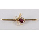 A yellow metal spider brooch, stamped 9ct, set amethyst and seed pearls, 2.7g