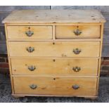 A pine chest of two short and three long drawers, on turned supports, 37 1/2" wide x 18" deep x 34