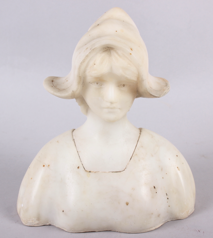 A white marble bust of a young woman, 6 1/2" high (restorations)