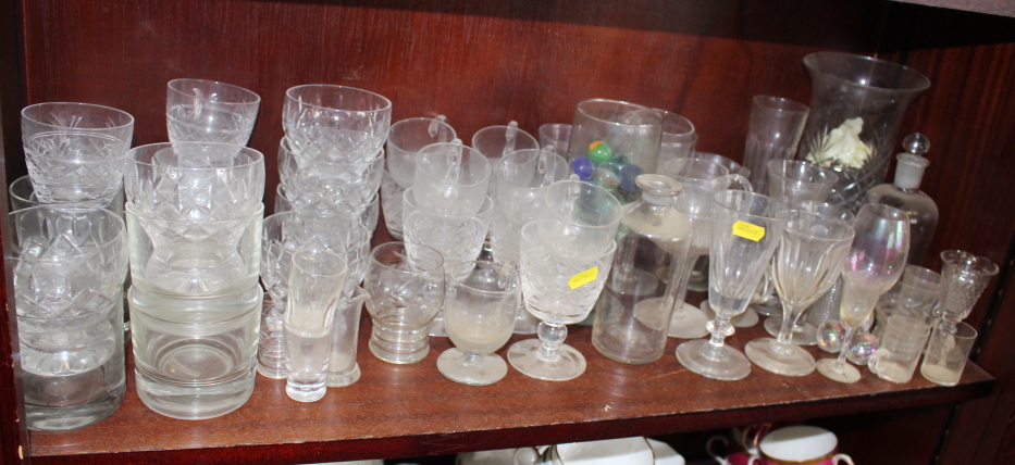 A quantity of custard cups, whisky tumblers, a celery vase, pedestal drinking glasses and other