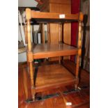 A mahogany three-tier whatnot, on turned supports, 16" square