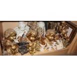 A quantity of mostly china putti, largest 10 1/4" high
