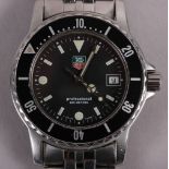 A gentleman's Tag Heuer Professional stainless steel bracelet watch with black dial, baton