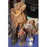 Two Continental carved and painted wood religious figures and a paperweight