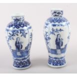 A pair of 19th century Chinese blue and white vases, decorated panels with figures, birds and