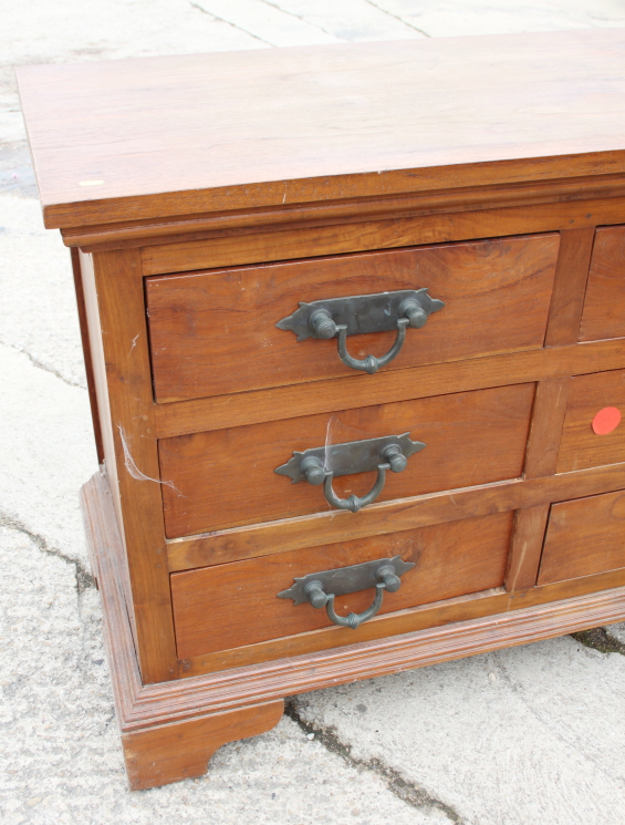 An Oriental hardwood chest of nine drawers with heavy brass handles, on bracket feet, 71" wide x 21" - Image 2 of 4