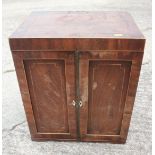 A collector's Edwardian mahogany and line inlaid chest of eight graduated drawers enclosed two