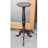A mahogany torchere stand with reeded and fluted column, on tripod supports, 33 1/2" high