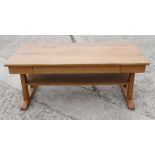 An oak two-tier plank top coffee table, fitted frieze drawer, 22" wide x 48" long x 19" high