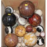 A collection of mostly stone spheres, including jasper, marble and onyx