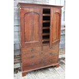 A mid Victorian mahogany and banded linen press, the upper section fitted trays and enclosed arch