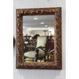 A carved giltwood acanthus scroll framed wall mirror, plate 23" x 15"