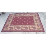 A tapestry rug with elephant design in shades of red and fawn, 68" x 53" approx, and a Bokhara