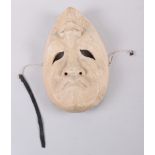 A happy or sad wooden mask, 9" long
