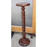 An oak barley twist column torchere stand, on circular base, 35" high