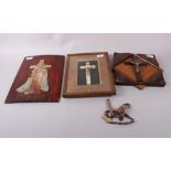 An inset carved soapstone figure of Christ, a mother-of-pearl Corpus Christi, in oak frame, and