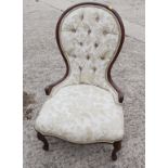 A late 19th century mahogany showframe low seat nursing chair, on cabriole supports