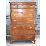 A George II figured walnut and feather banded chest on chest, the upper section with canted corners,