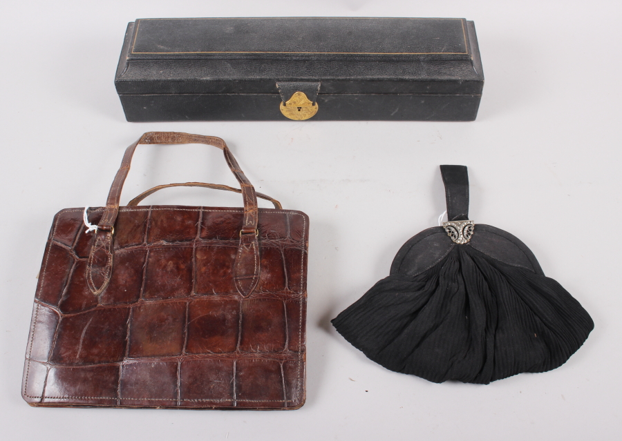 A morocco leather scroll box with silk lining, a crocodile skin handbag and a black evening purse