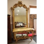 A 19th century painted and gilt pin framed pier mirror and console table with pierced crest and