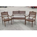 An Edwardian carved frame cane seat and back settee and matching armchairs, an oak drop leaf