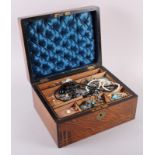 A rosewood and brass inlaid jewellery box, containing a selection of costume jewellery, including