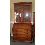 A George III mahogany bureau bookcase, the upper section enclosed astragal glazed doors, over fitted