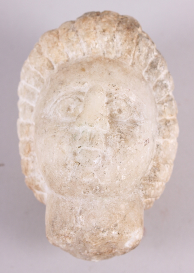 An antique white marble head, 4 1/4" high